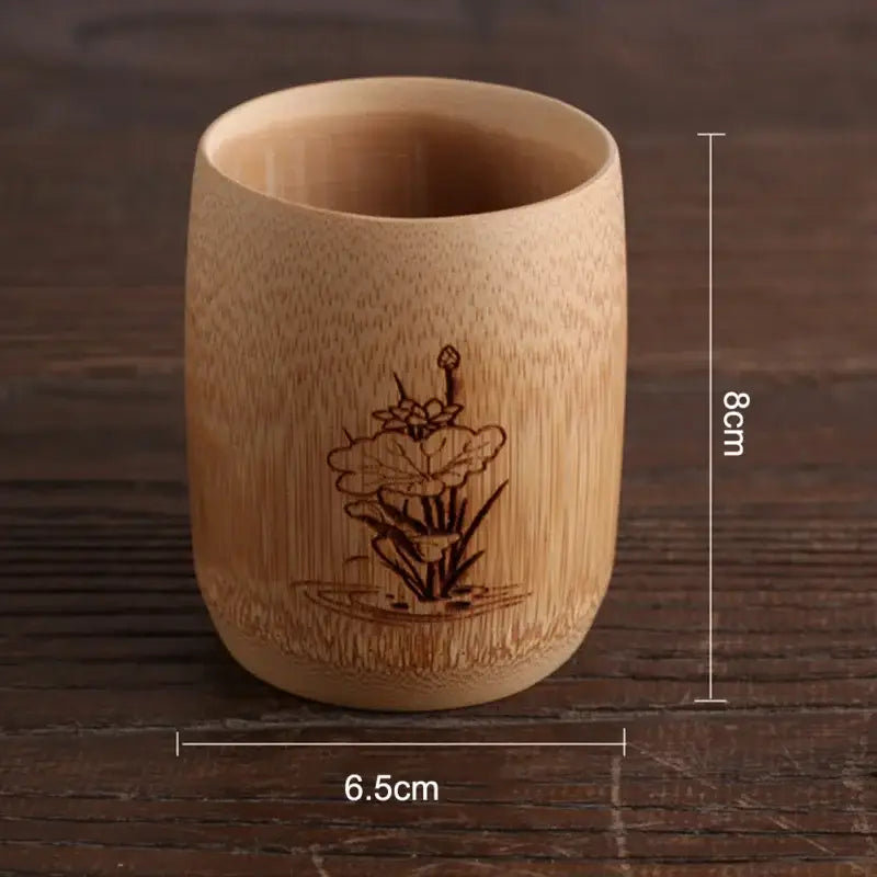 A light brown bamboo drinking cup with a hand carved lotus flower design from decorbites vintage drinking cup set