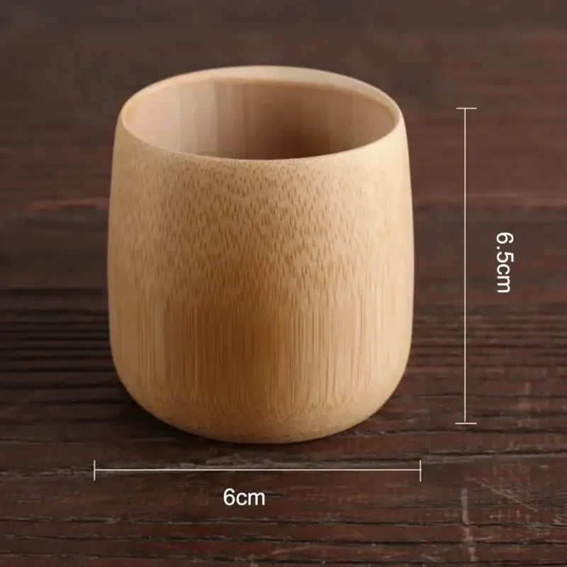 A light beige vintage engraved bamboo drinking cup with smooth texture and subtle vertical grain patterns decorbites bamboo drinking