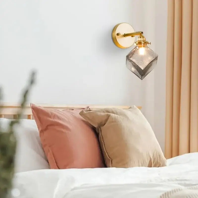 Gold-toned wall lamp with faceted grey glass led shade vintage etched brass sconce for bedroom decorbites grey glass design