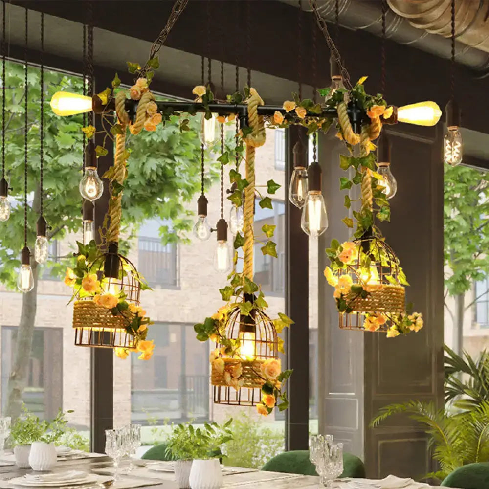 Decorbites vintage metal island light with birdcage design features woven wicker, yellow roses, green ivy, and hemp rope in black