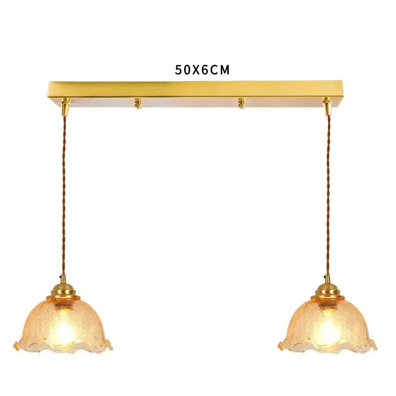 Gold-toned pendant light with two hanging amber cracked glass shades for vintage floral living room decorbites cracked glass