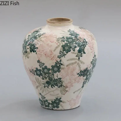 A cream-colored ceramic vase with delicate pink and green floral patterns featuring decorbites cracked texture blue design