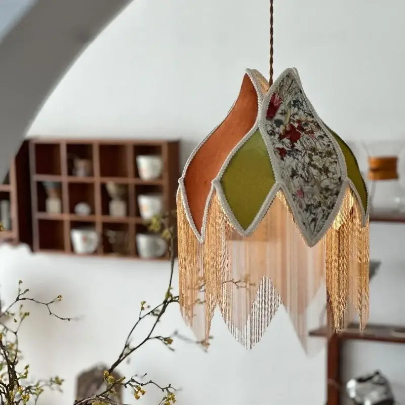 A delicate vintage floral pendant lamp with colorful tassel led fabric shade and gold-toned fringe decorbites colorful tassel
