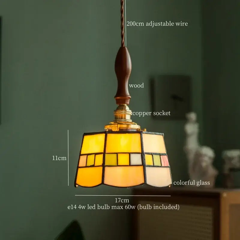 A warm-toned vintage floral stained glass pendant light with amber and cream geometric panels for living room decorbites colorful flower lighting