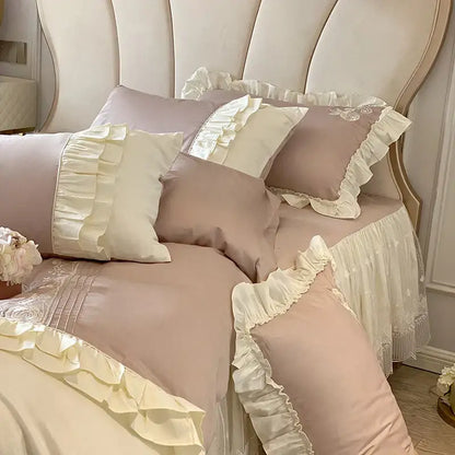 Vintage french bedding set featuring pastel pink and cream ruffles with delicate lace trim for bedroom decor
