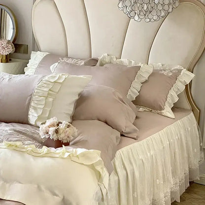 Cream-colored vintage french bedding set with ruffles lace trim and plush pillows arranged on a bed