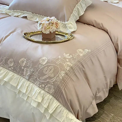 Beige satin duvet cover with delicate white floral embroidery and vintage french ruffles in a bedding set