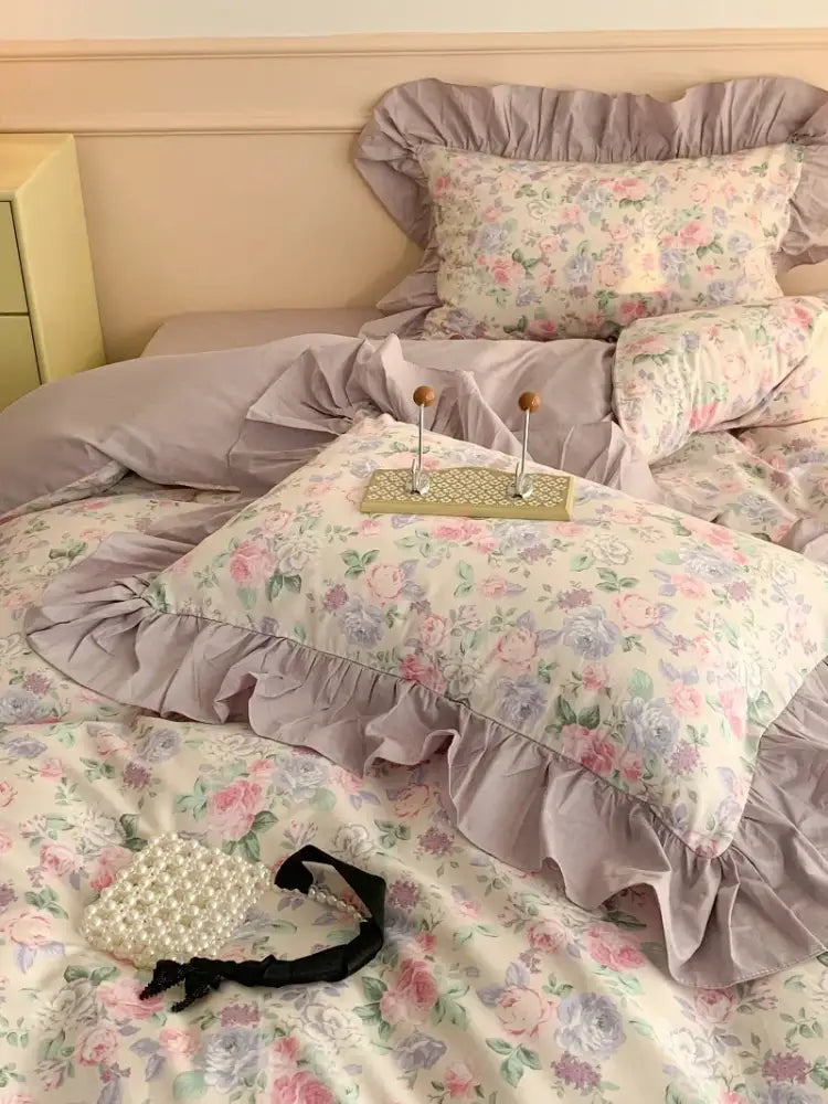 A delicate pearl-embellished clutch with black ribbon accent displayed alongside decorbites french floral cotton bedding set lavender bedroom ruffles