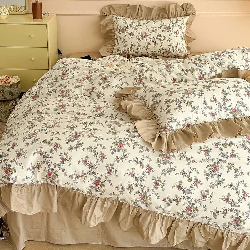 Beige ruffled vintage french floral cotton bedding set with delicate pink and green blossoms on cream background