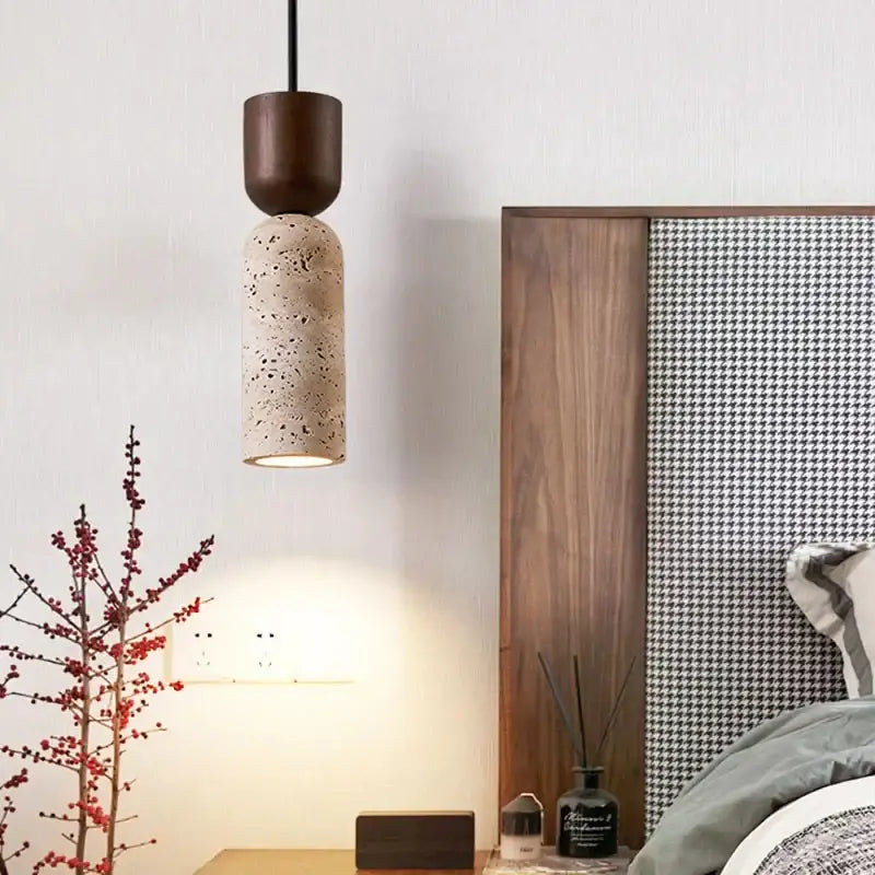 A vintage french pendant light with a dark wood top and beige textured stone pendant light for dining room use