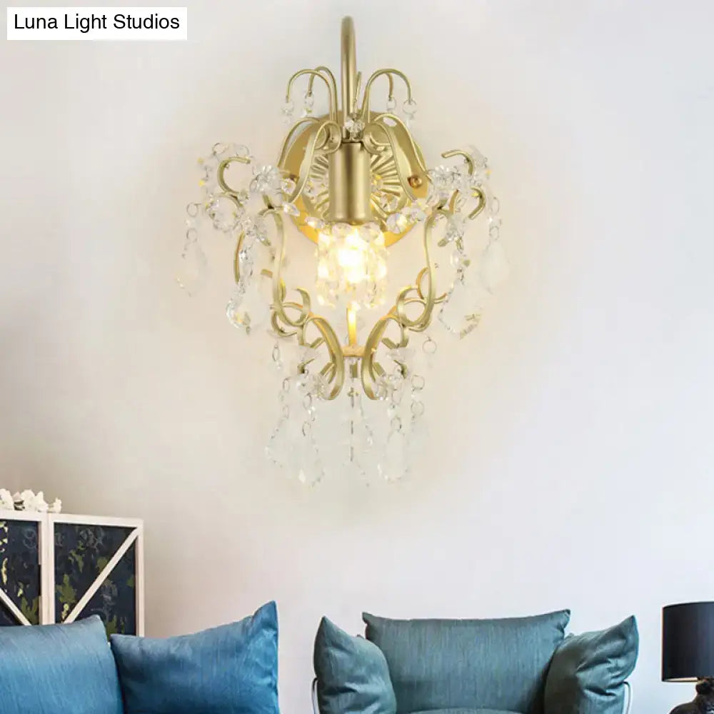 Vintage geometric wall lamp with gold finish and ornate metalwork adorned with crystal droplets for bedroom use
