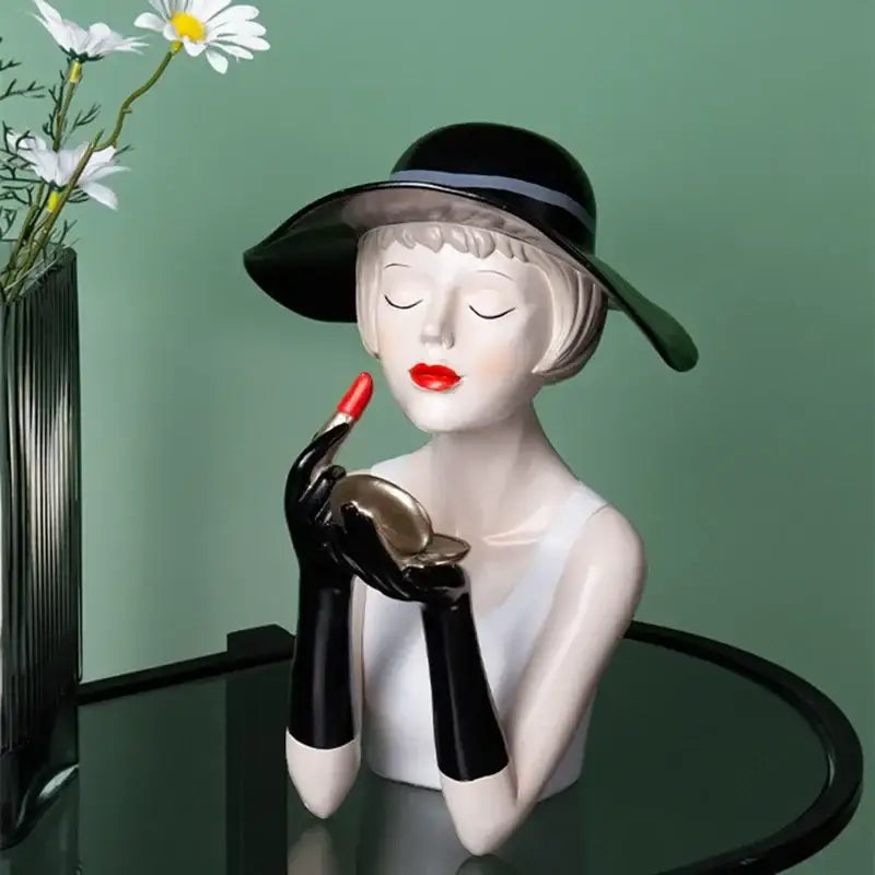 Glossy black and white ceramic vintage glamour resin bust with wide-brimmed hat holding lipstick for decorbites elegant living room decor