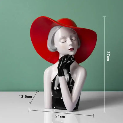 A glossy ceramic vintage glamour resin bust of a woman in a red hat and black polka-dot dress for decorbites elegant living room decor