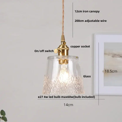 Clear glass pendant lamp with textured leaf-patterned base and brass-finished metal in vintage glass copper led style