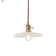 Vintage glass copper led pendant lamp with brass metal fixture and faceted glass shade hanging from twisted cord
