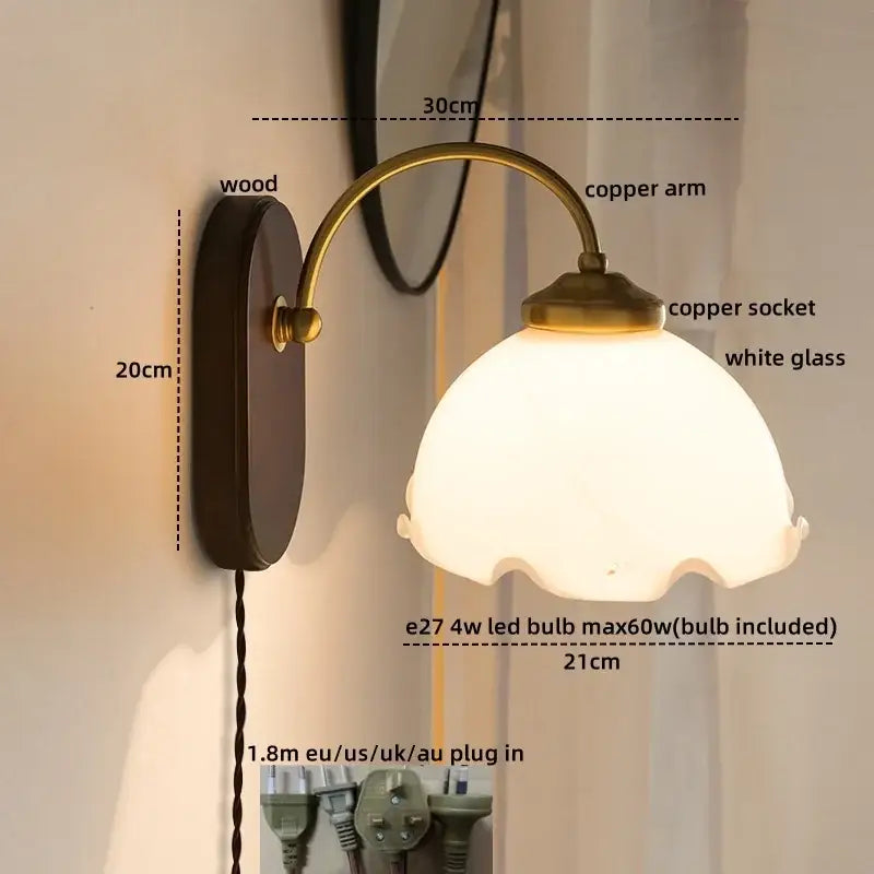 Antique brass-finished copper led wall sconce with white glass shade and wood backplate for bedroom wall lights