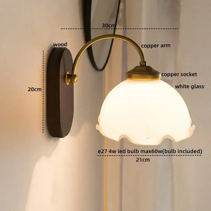 Vintage glass copper led wall light with scalloped white shade and dark wood backplate for bedroom lighting
