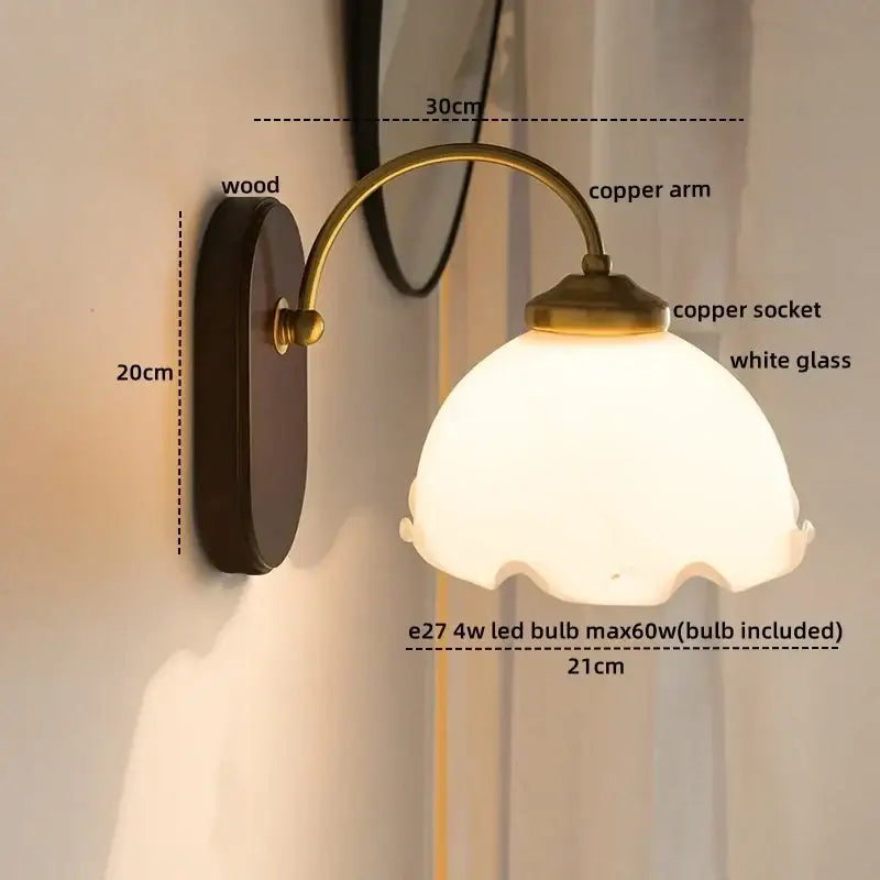 Vintage glass copper led wall light with scalloped white shade and dark wood backplate for bedroom lighting