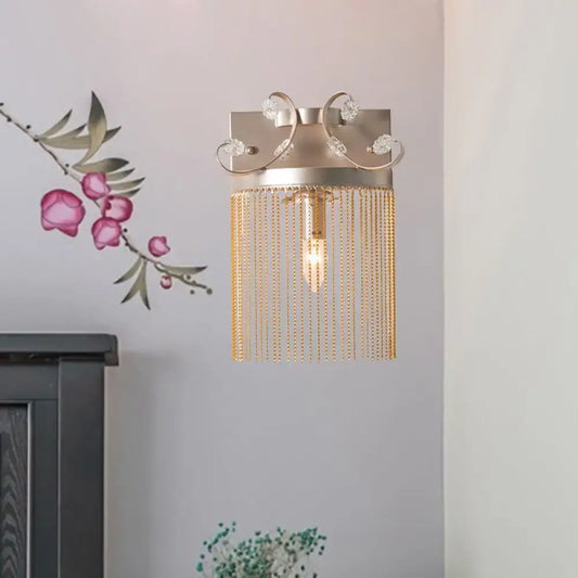 Vintage gold aluminum tassel wall light with brushed metallic finish crystal accents and decorative gold chains wall light fixture