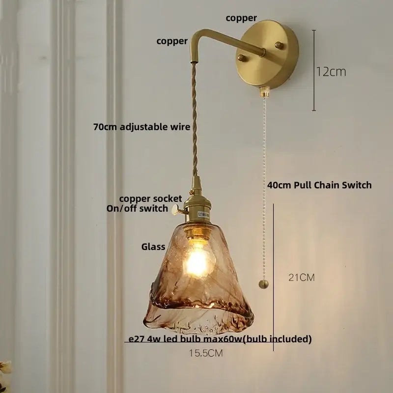 Vintage gold and amber glass led wall light featuring a copper sconce with textured amber vintage led shade and adjustable wire