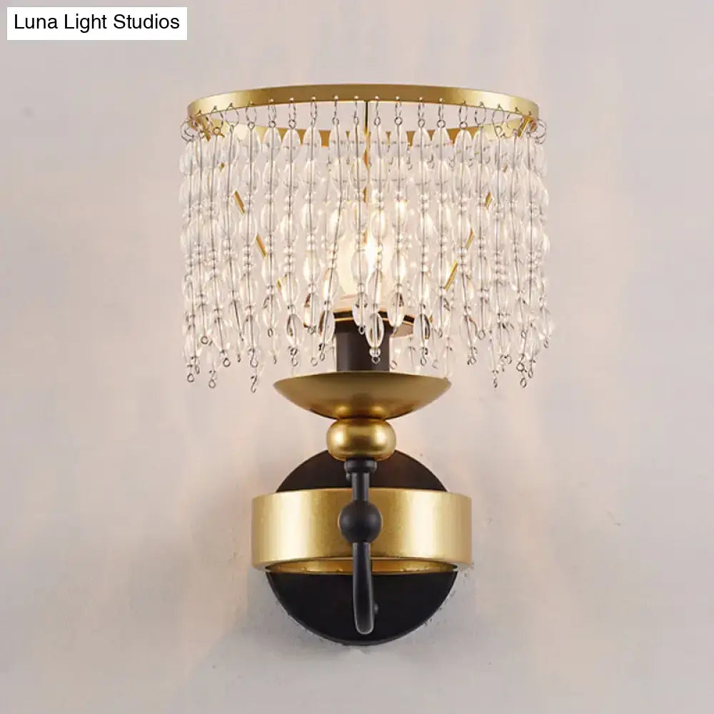 Vintage gold and black crystal sconce wall light with retro fringe drape and cascading clear crystal beads for bedroom use