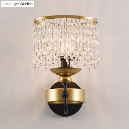Vintage gold and black crystal sconce wall light with retro fringe drape and cascading clear crystal beads for bedroom use