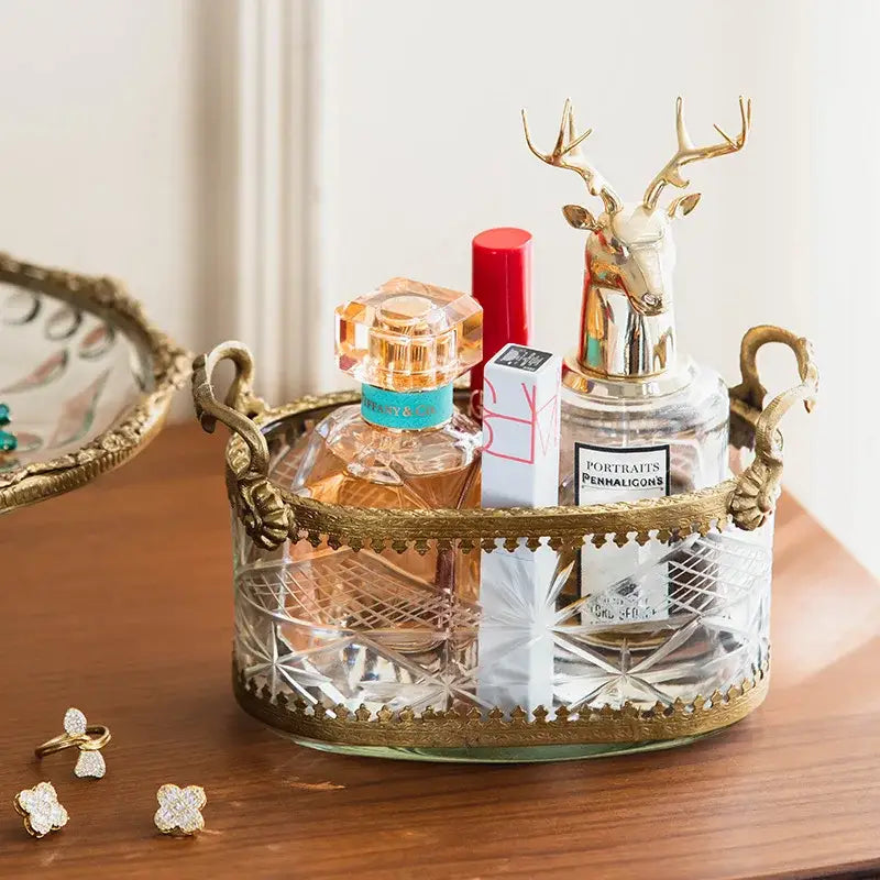 Vintage gold and carved glass storage box with ornate handles and deer-head stopper for snack plate or dining room use