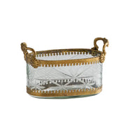Vintage gold storage box featuring a clear cut carved glass oval basket with gold toned metal handles and decorative borders