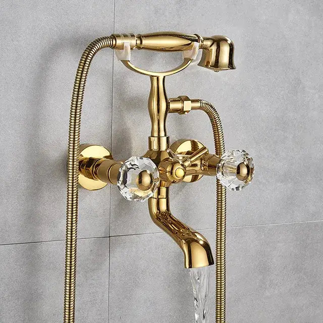 Vintage gold and black bathtub faucet with gold-finished brass, crystal knobs, and flexible hose by decorbites golden black
