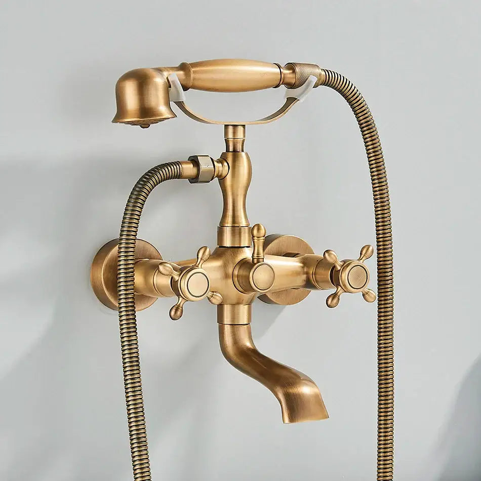 Antique brass vintage gold and black bathtub faucet with two ornate cross handles and handheld showerhead decorbites golden black