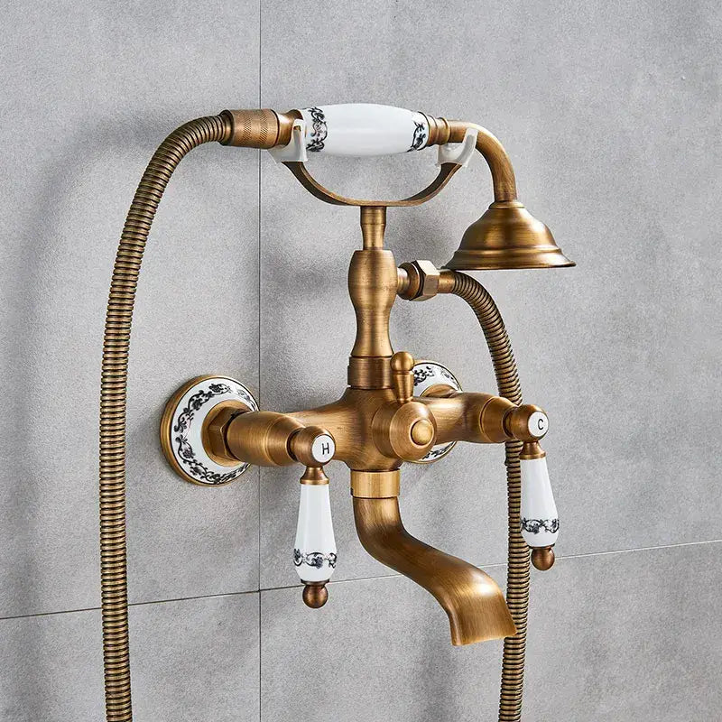 Antique brass vintage golden black bathtub faucet with white ceramic handles and matching showerhead by decorbites