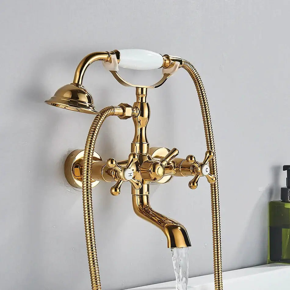 Vintage gold and black bathtub faucet with white ceramic cross handle and two flexible shower hoses by decorbites golden black