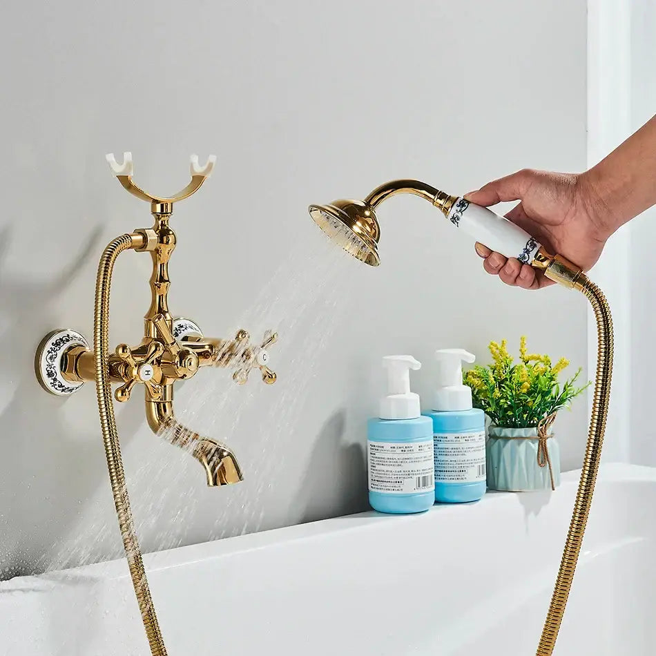 Vintage gold and black bathtub faucet with ornate cross handles and matching handheld showerhead by decorbites golden black bathtub