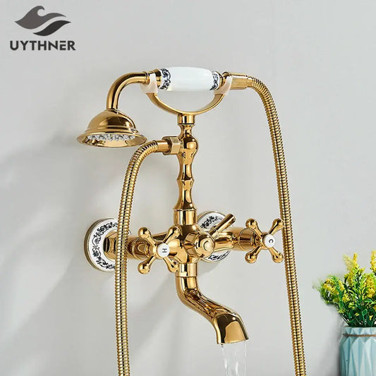 Vintage gold and black bathtub faucet with ornate cross handles and blue floral ceramic knobs by decorbites golden black bathtub