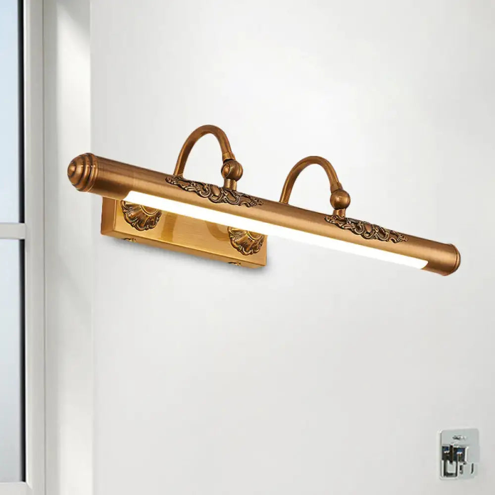 Antique brass-finished vintage gold vanity light bulb fixture with ornate scrollwork and two curved arms for bathroom wall decor