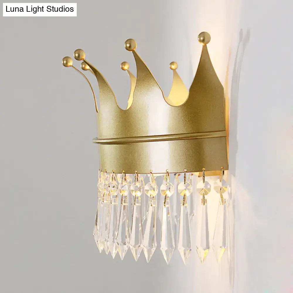 Vintage gold crown wall lamp with clear crystal prisms designed as a bedroom sconce
