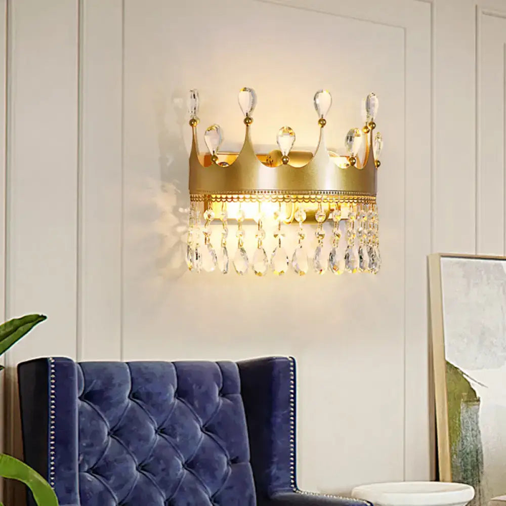 Vintage gold crown-shaped wall lamp adorned with clear crystal droplets for elegant bedroom sconce lighting