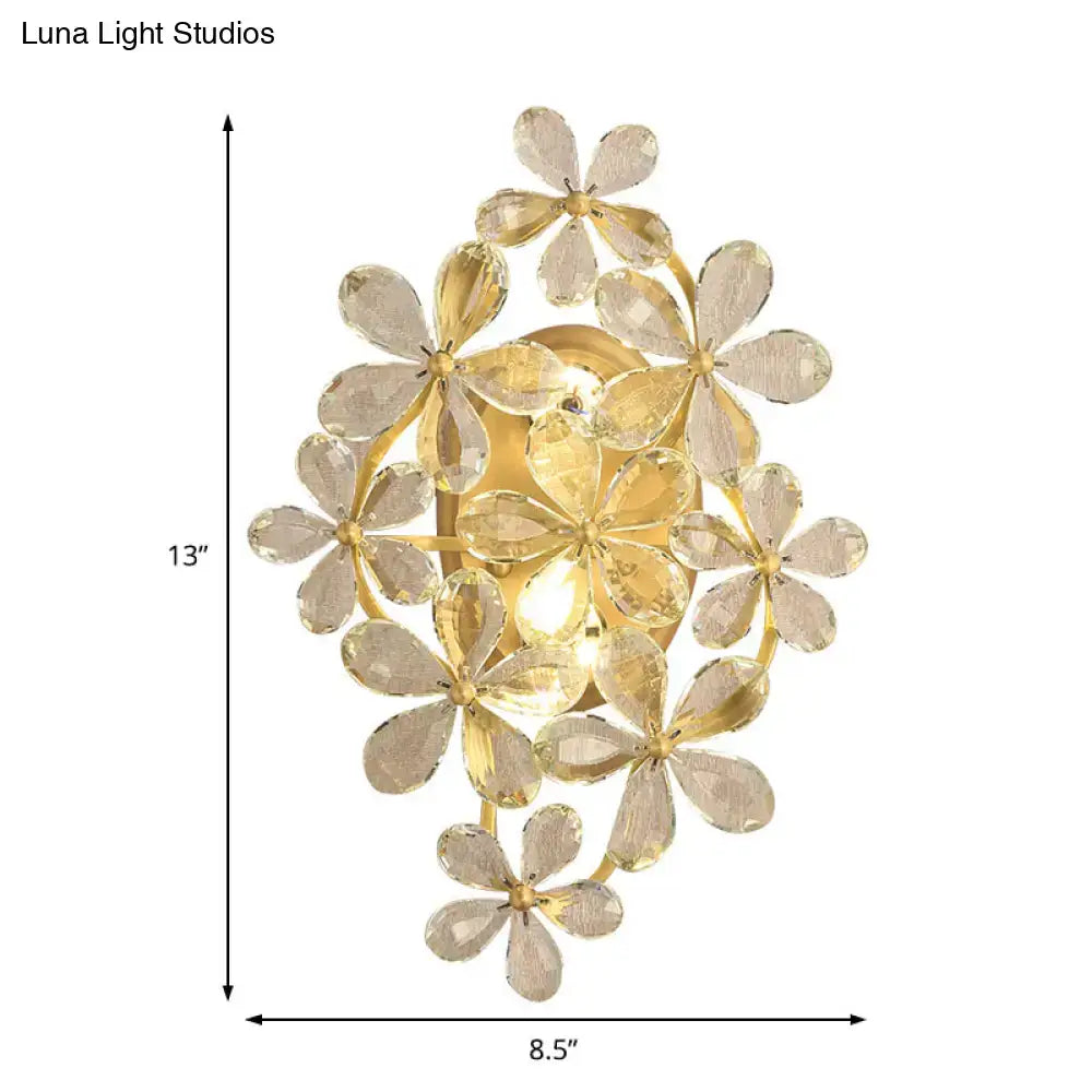 Vintage gold crystal flower wall sconce featuring clear faceted flower-shaped crystals for bedroom lighting