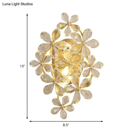 Vintage gold crystal flower wall sconce featuring clear faceted flower-shaped crystals for bedroom lighting