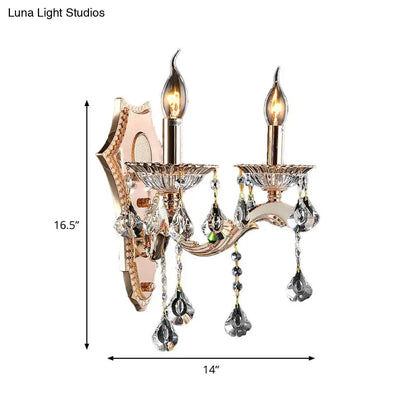 Rose gold two-light crystal sconce light fixture with dangling teardrop crystals direct wired electric bedroom mount