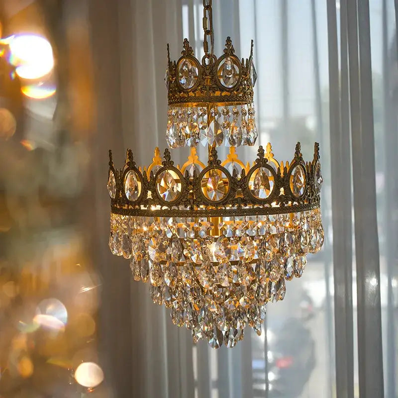 Vintage gold decorbites crown crystal chandelier featuring a golden crown shape with cascading clear crystal droplets