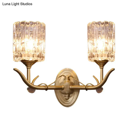 Antique brass two-light wall sconce with textured clear glass shades and vintage gold finish for 220v-240v corridors