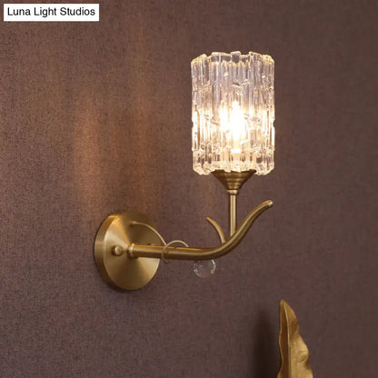 Brass wall sconce with a vintage gold finish clear glass textured shade and elegant curved arm 110v-120v for corridor