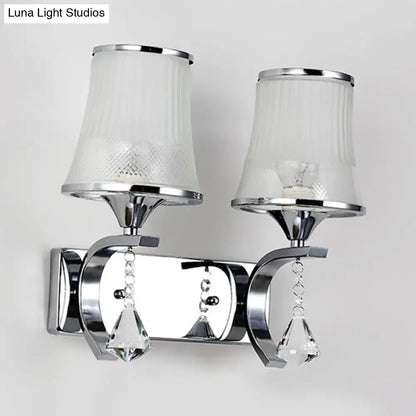 Vintage gold finish wall lamp with clear glass shades and chrome-finished crystal pendants for bedroom lighting