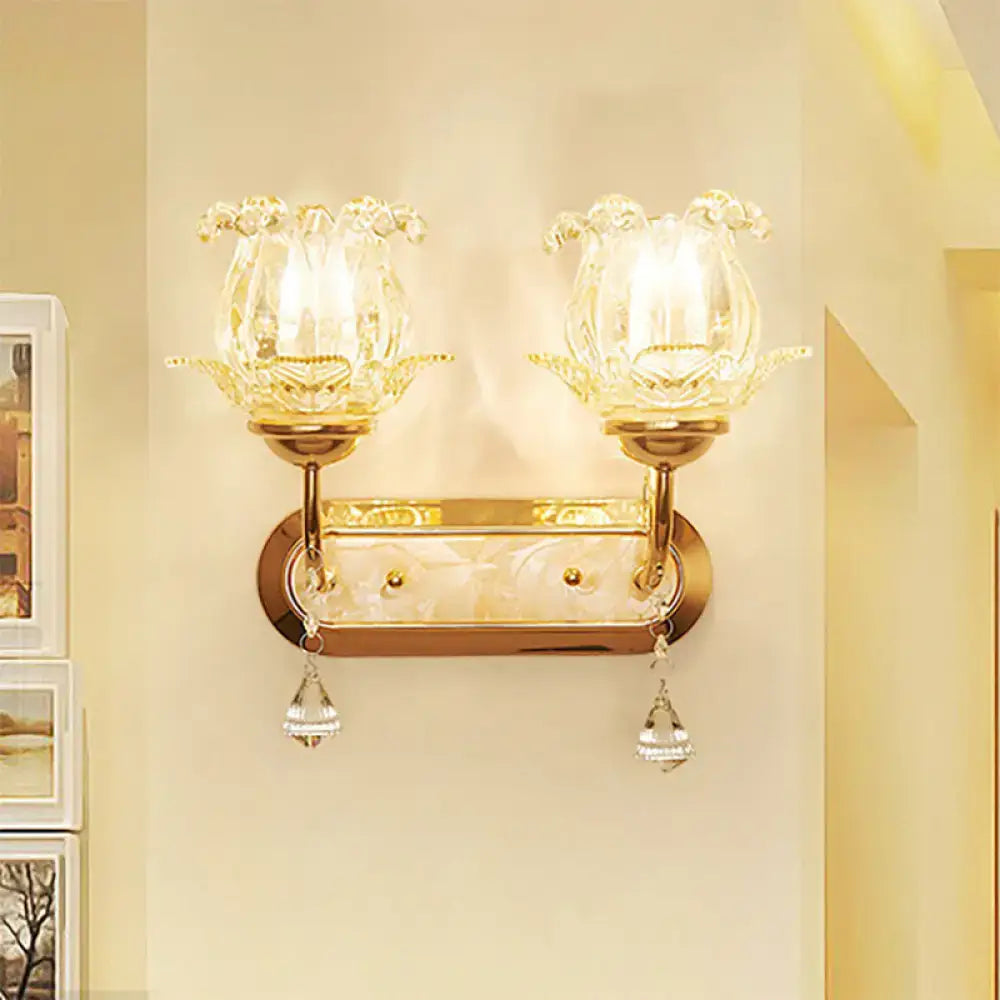 Vintage gold flower wall sconce with amber glass shade lotus flower design and dangling crystal teardrop pendants