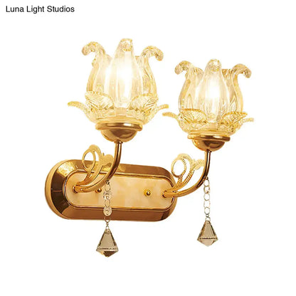 Vintage gold flower wall sconce with amber glass shade, pull chain, and crystal teardrop pendants for bedroom lighting