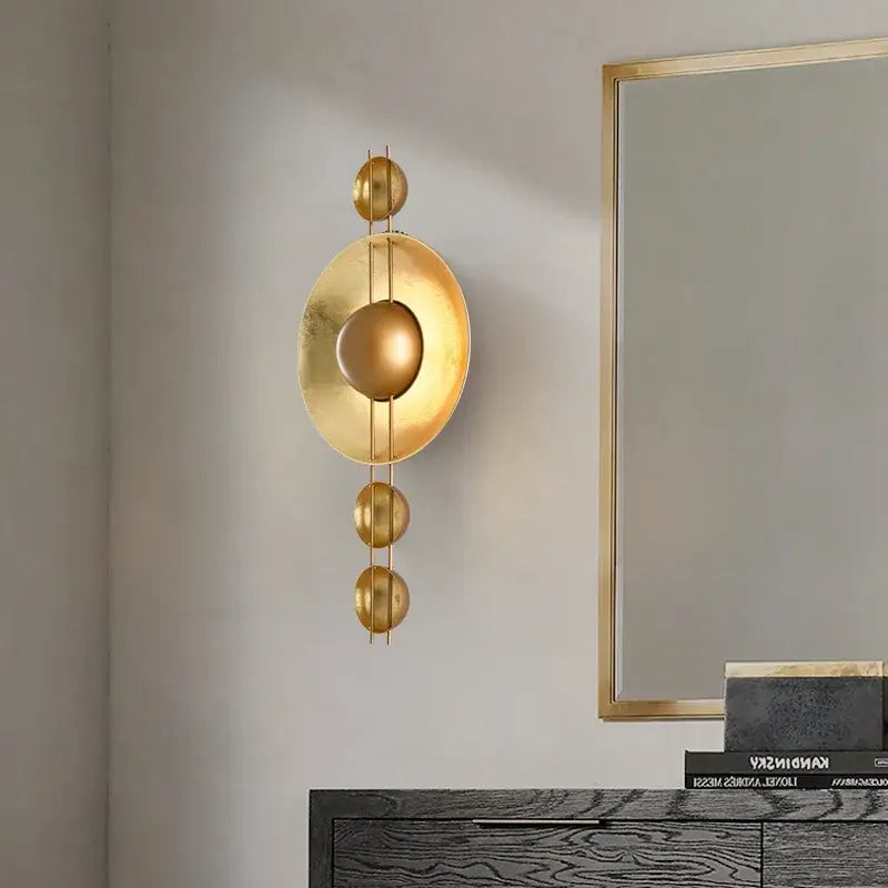 Vintage gold led geometric wall lamp featuring golden concentric circular and spherical elements for luxe bedroom decorbites gold led decor