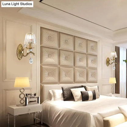 Beige tufted leather headboard with sunburst pattern complementing vintage gold metallic wall lamp crystal sconce