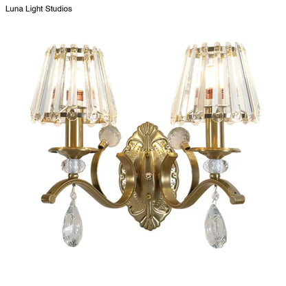 Vintage gold metallic wall lamp with brass finish crystal chandelier shades and dangling teardrop crystals for bedroom use