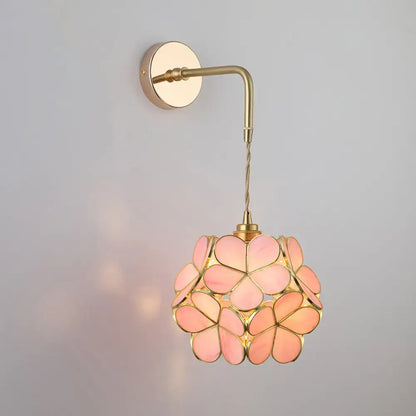 Decorbites vintage single-bulb bedside wall light in gold with delicate pink shaded glass wall light and brass hardware